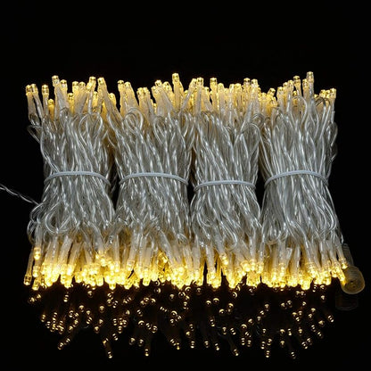 YULETIME 100 ft 300 Count Warm White LED String Lights with 8 Models Adapter, Clear Wire Wide Angle 5mm Christmas Lights (Warm White - Multimode)