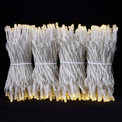 YULETIME 100 ft 300 Count Warm White LED String Lights with 8 Models Adapter, Clear Wire Wide Angle 5mm Christmas Lights (Warm White - Multimode)