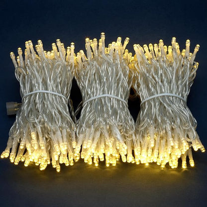 YULETIME 100 ft 300 Count Warm White LED String Lights with Adapter, Clear Wire Wide Angle 5mm Christmas Light (Warm White)